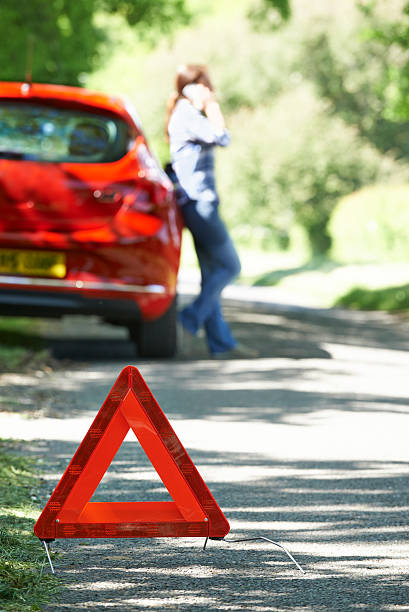 istock Female Driver Broken Down On Country Road 477181852