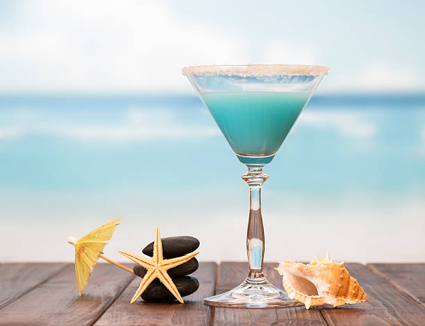 istock Cocktail with umbrella and starfishes 477184246