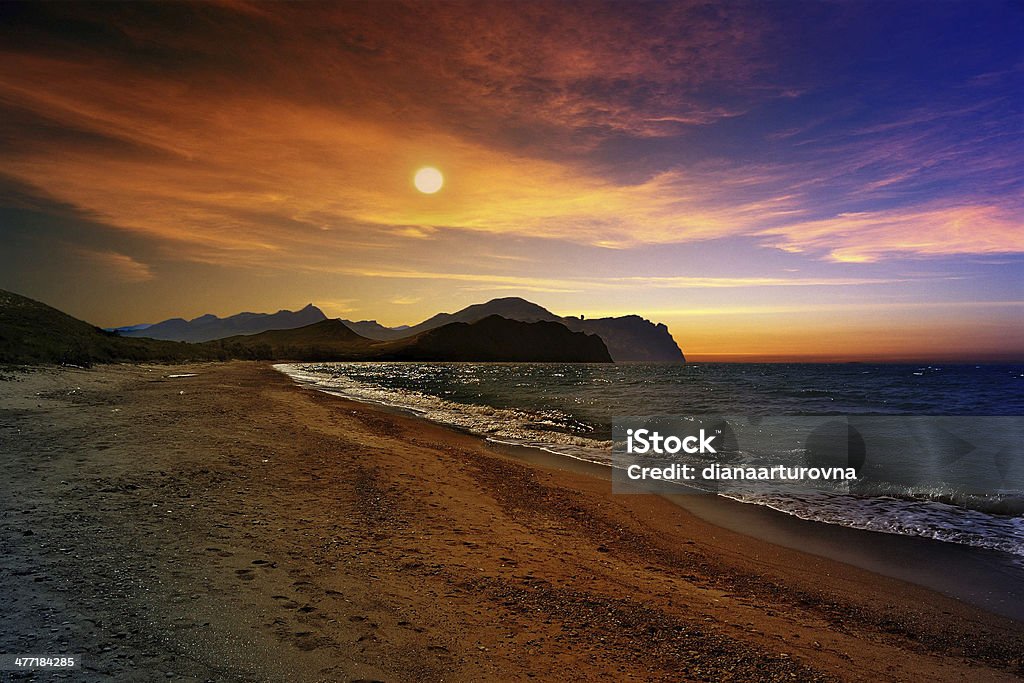 Sea sunset Dramatic sunset and the blue sea surf Beach Stock Photo