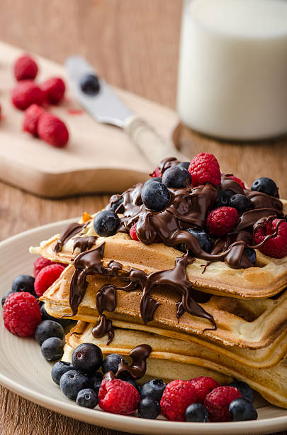 istock Homemade belgian waffles with fruit and chocolate 477184332