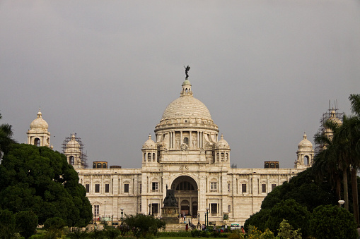 Victoria Memorial Hall, Kolkata, India in a rainy day with overcast sky. It is dedicated to the memory of Queen Victoria and is now a museum and tourist destination under the auspices of the Ministry of Culture.