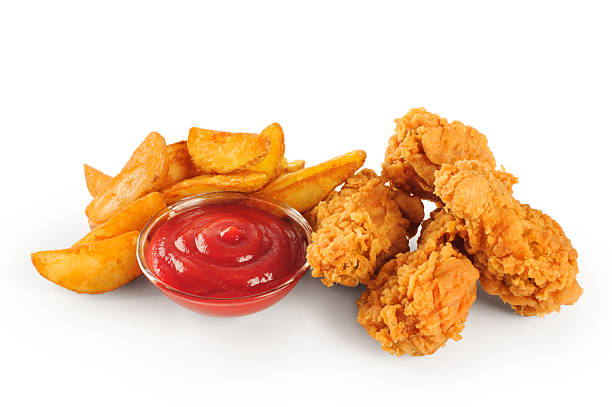 istock Fried chicken wings potatoes and ketchup 477187994