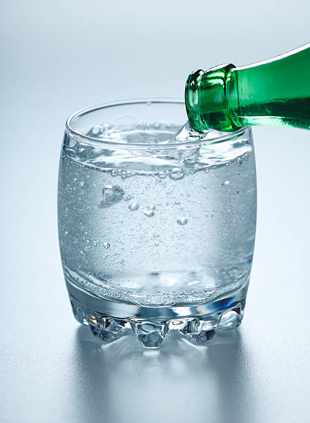 istock Mineral water pouring into glass 477191552