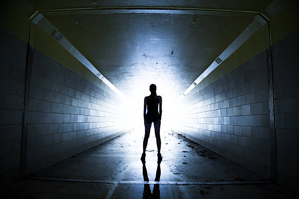 Female athlete posing in a tunnel Shot with a DSLR   In a tunnel with a grungy look for effec ominous photos stock pictures, royalty-free photos & images
