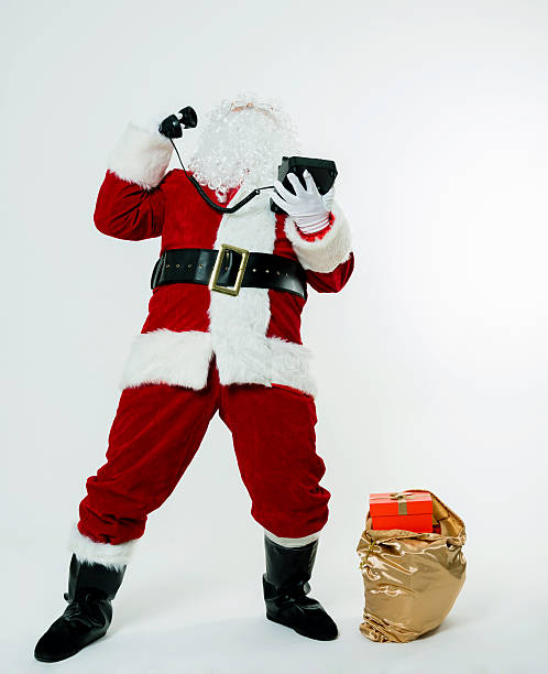 istock Santa claus speaking on phone 477203866