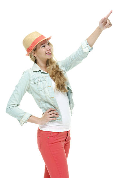 istock Smiling woman pointing away 477206334