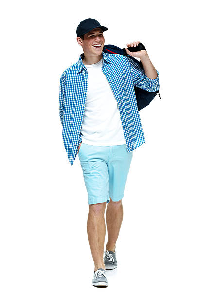 istock Cheerful casual man holding duffle bag and walking 477206336