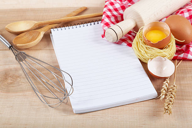 istock Baking ingredients for cooking and notebook for recipes. 477210832
