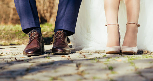 istock Legs Of Wedding Couple 477211298