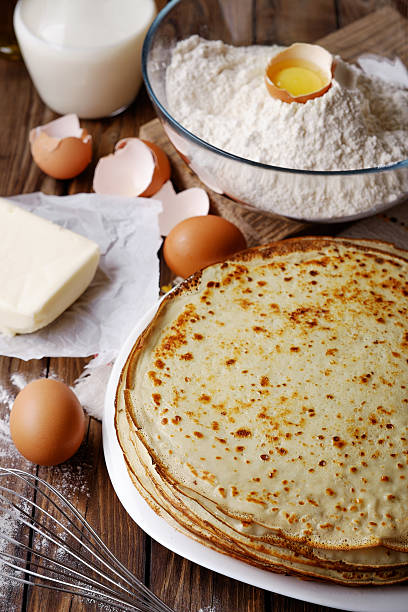 istock Stack of crepes and ingredients for cooking 477214182