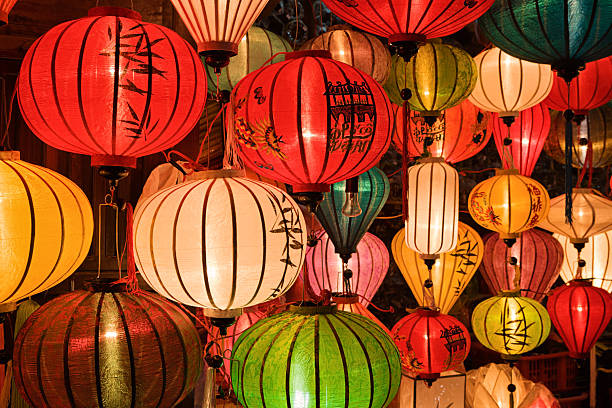 Colorful silk lanterns for sale in Hoi An city, Vietnam Colorful silk lanterns for sale in Hoi An city, Vietnam. Asian ( Chinese / Vietnamese ) traditional silk hanging lanterns lanterns in Hoi An. Hoi An is situated on the east coast of Vietnam. Its old town is a UNESCO World Heritage Site because of its historical buildings. chinese lantern lily photos stock pictures, royalty-free photos & images