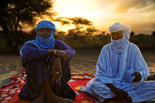 Timbuktu, Mali - september - 02 - 2011 Tuaregs resting on his carpet and ready to drink tea after a hard day's trek through the desert to Timbuktu