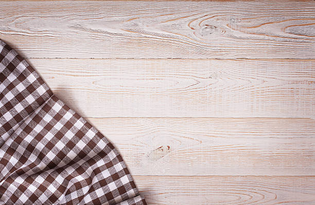istock Tablecloth tartan on white wooden table. Flat mock up. Top 477217122