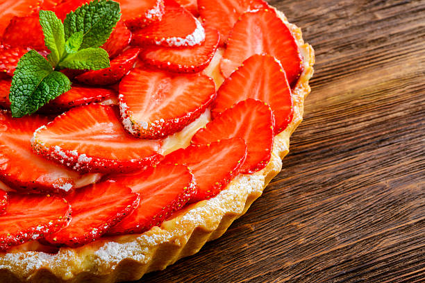 istock Berry pie. Strawberry tart on rustic wooden table 477217442
