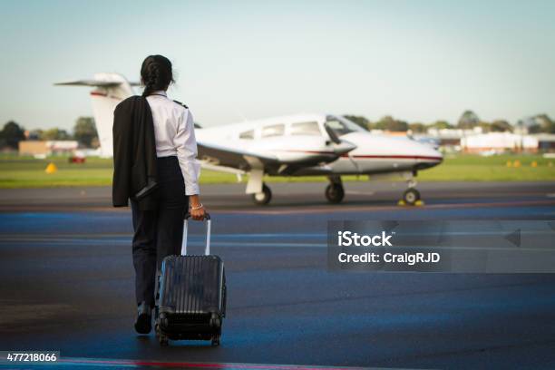 Pilot Departing Stock Photo - Download Image Now - Pilot, Women, Females
