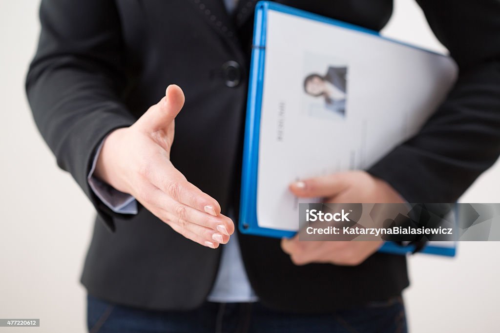 Woman with curriculum vitae Horizontal view of woman with her curriculum vitae Résumé Stock Photo