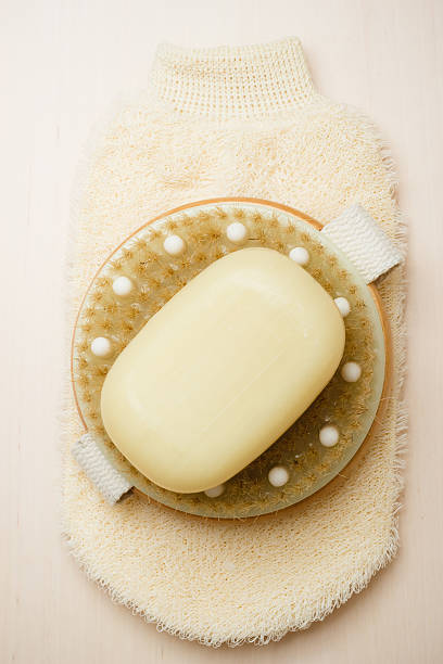 istock body brush soap and scrub glove 477221222
