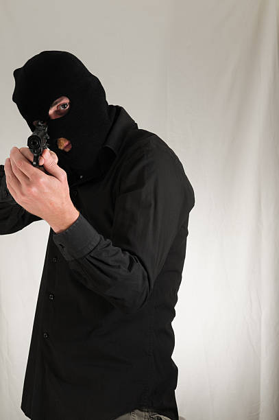 istock Man Holding a Pistol Gun 477221373