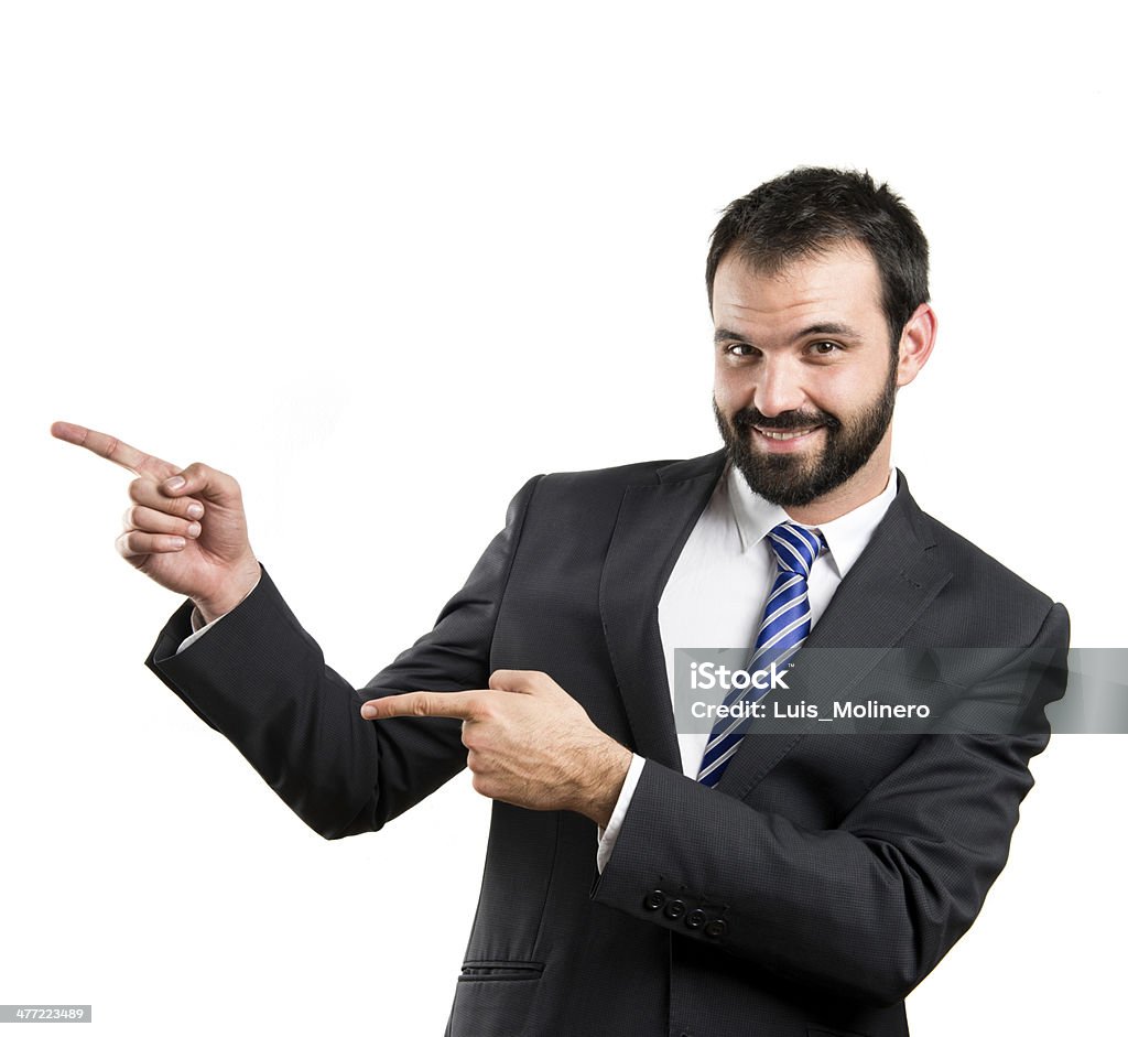 Businessman pointing to the side over white background Adult Stock Photo