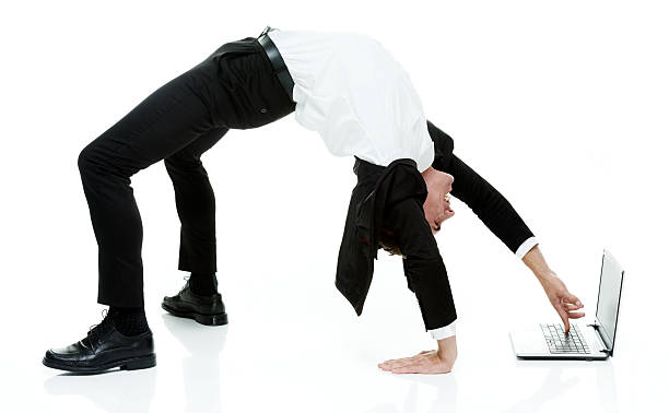 istock Businessman using laptop in yoga posture 477226852