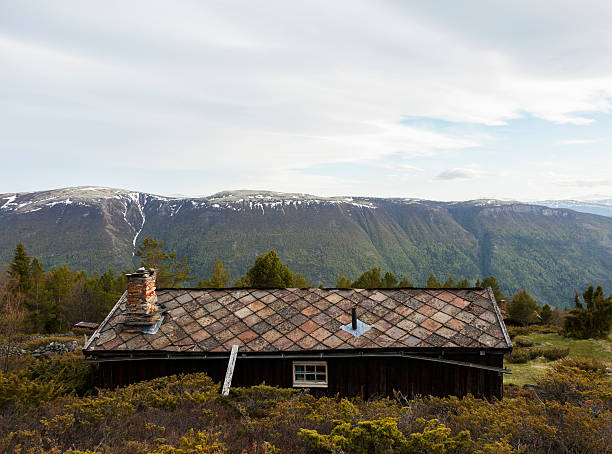 Condemned house in the Norwegian mountains at sunset.  Sel, Gudbrandsdalen, Norway. 