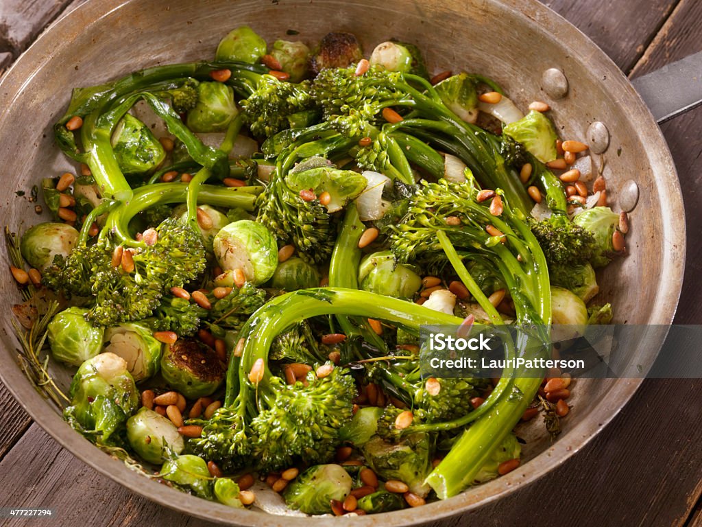 Roasted Broccolini and Brussels sprouts Roasted Broccolini and Brussels sprouts with Garlic and Fresh Herbs in a Pan-Photographed on Hasselblad H1-22mb Camera Brussels Sprout Stock Photo