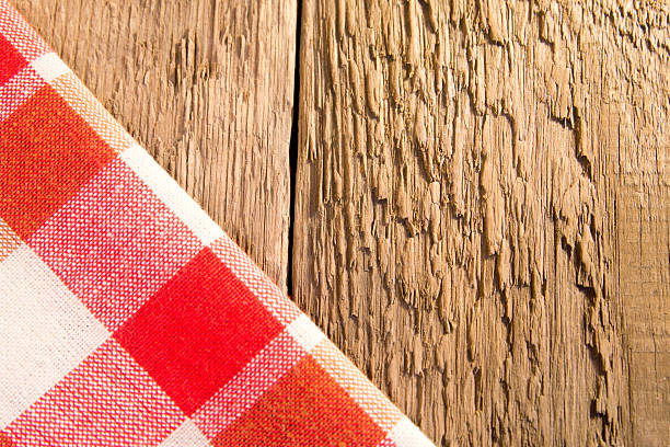 istock Checkered napkin on wooden bacground 477230370