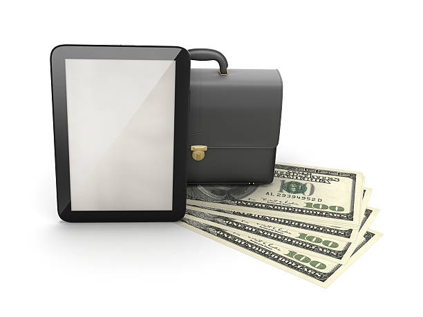 Tablet computer, leather briefcase and dollar bills stock photo