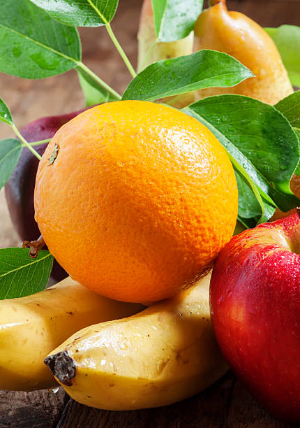 istock Colored fruits on wooden table 477233528