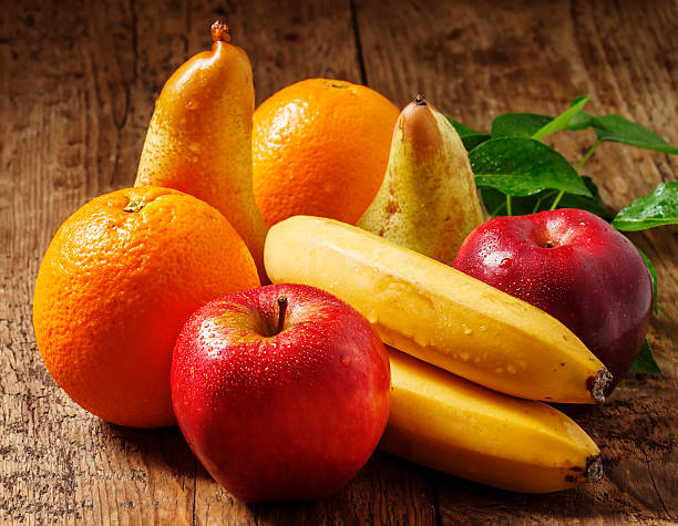 Colored fruits on wooden table