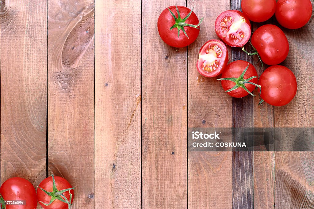 Cherry Tomato Cherry tomatoes on wooden table background with copy space 2015 Stock Photo