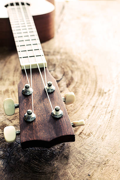 istock Close up of ukulele on old wood textured 477236480