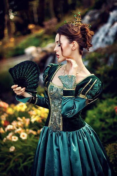 istock Princess with a fan near the waterfall 477246162