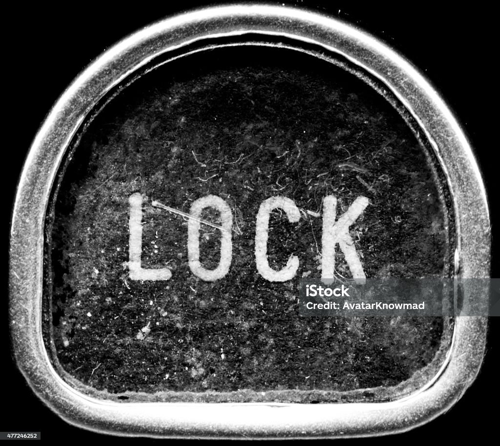 LOCK A black and white macro shot of a vintage typewriter key. This key features the word LOCK. 2015 Stock Photo