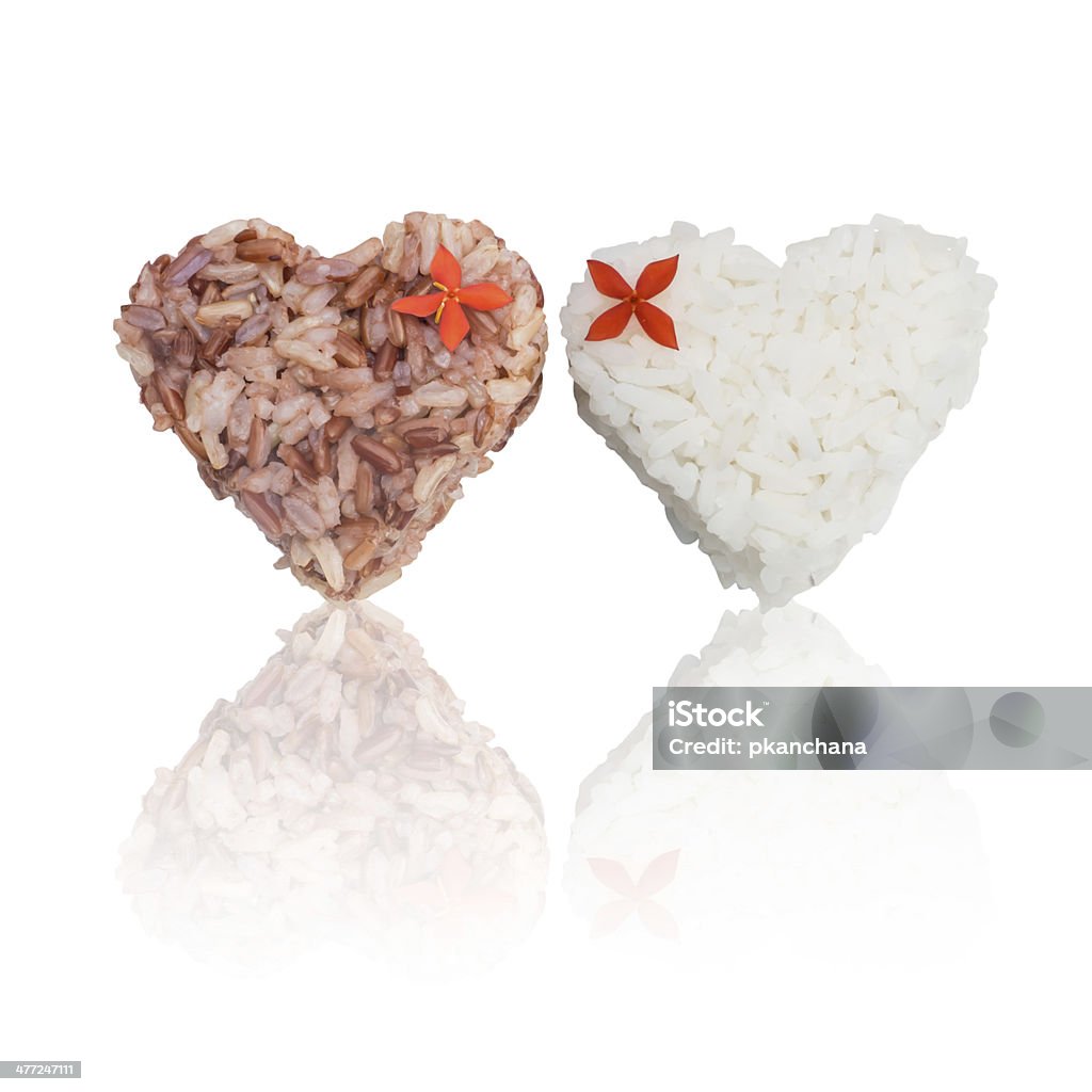 Jasmine rice and brown rice heart shape Jasmine rice and brown rice heart shape isolated on white Asia Stock Photo