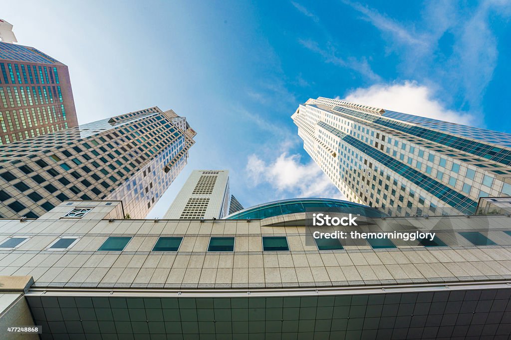 Modern glass city buildings during sunny day. Modern glass city buildings during sunny day. Low angle shot 2015 Stock Photo