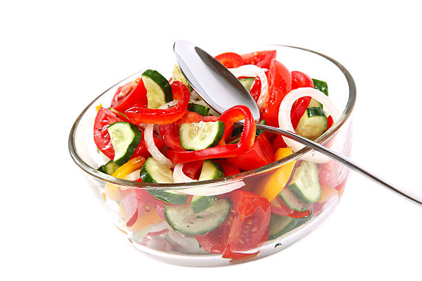 istock Fresh vegetable salad in a glass dish. 477250018