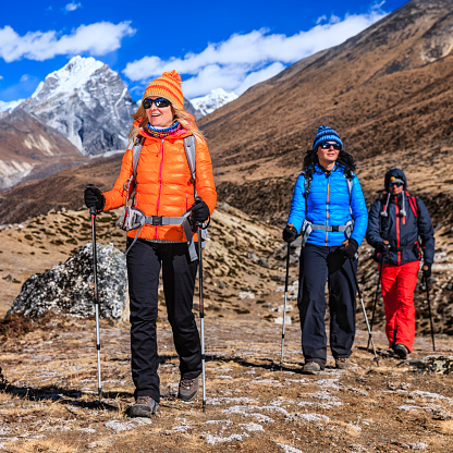 Group of trekkers in Mount Everest National Park. This is the highest national park in the world, with the entire park located above 3,000 m ( 9,700 ft). This park includes three peaks higher than 8,000 m, including Mt Everest. Therefore, most of the park area is very rugged and steep, with its terrain cut by deep rivers and glaciers. Unlike other parks in the plain areas, this park can be divided into four climate zones because of the rising altitude. The climatic zones include a forested lower zone, a zone of alpine scrub, the upper alpine zone which includes upper limit of vegetation growth, and the Arctic zone where no plants can grow. The types of plants and animals that are found in the park depend on the altitude.http://bem.2be.pl/IS/nepal_380.jpg