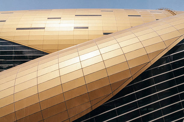 Golden colour metal cover tiles and modern glass windows from Dubai subway. UAE