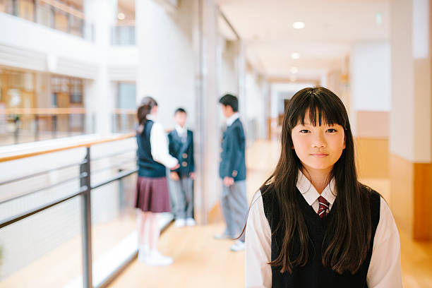 istock Japanese high school. Young student, three friends in the background 477252490