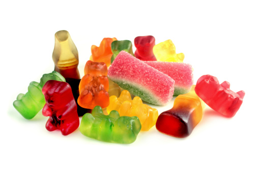 Brightly colored gummy bear on white background