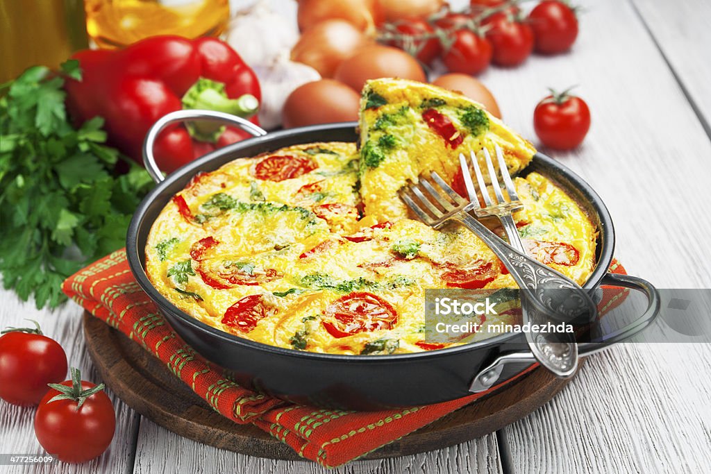 Omelet with vegetables and cheese. Frittata Omelet with vegetables and cheese. Frittata in a frying pan Baked Stock Photo