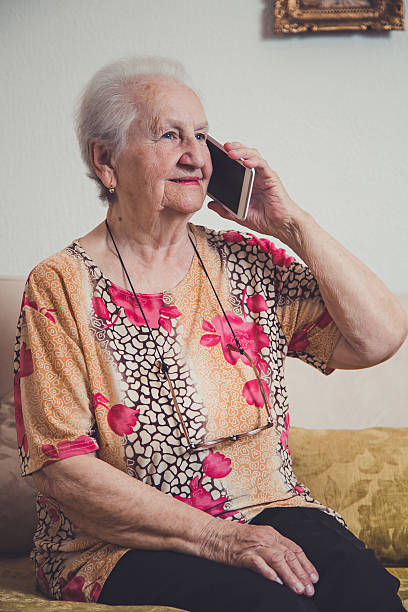 istock Senior woman talking on a mobile phone 477257884