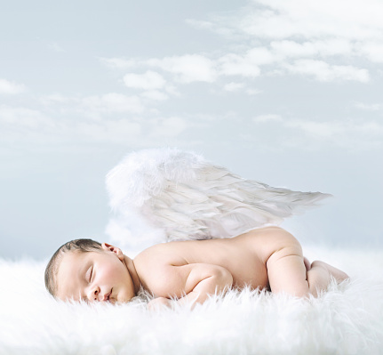 Portrait of a little baby as an innocent angel