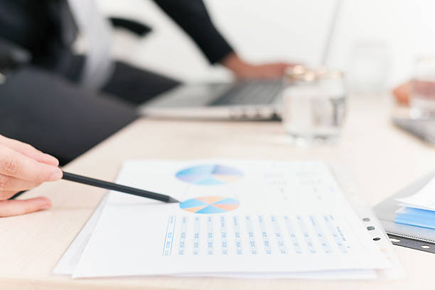 istock close-up graph and charts on table during business meeting 477260870