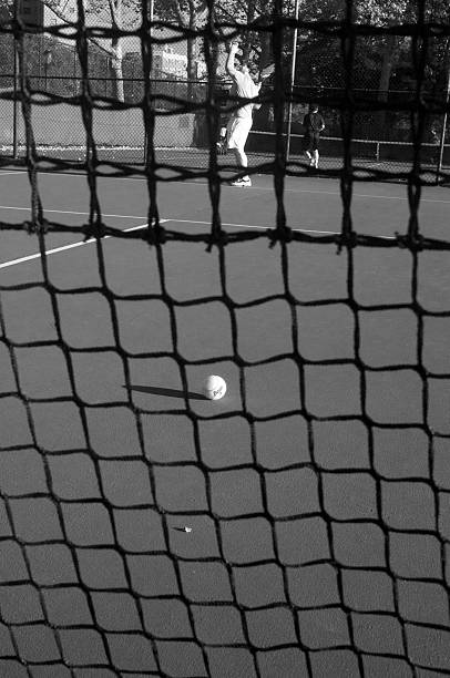 istock TEnnis Net Closeup with Ball and Server 477261847