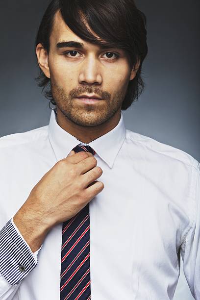 istock Handsome business executive wearing tie 477262129