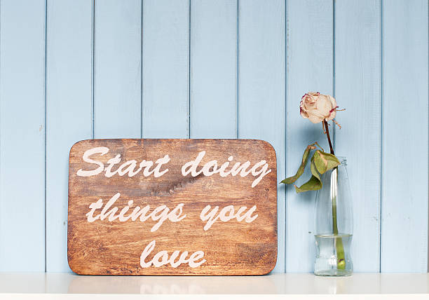 istock motivating poster and white rose 477268630