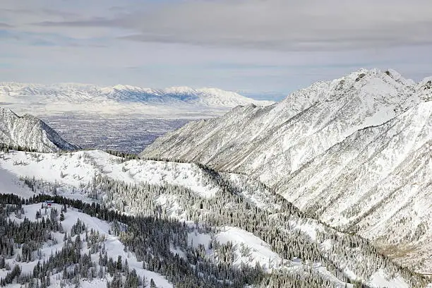 The view from the top of Snowbird Ski Resort, in Utah looking down over Salt Lake City below during winter.