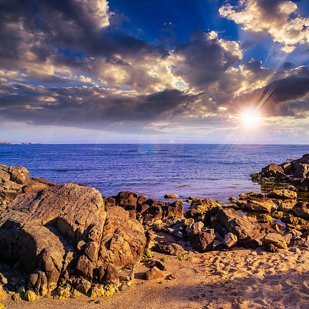 istock sea waves breaking on the sandy beach at sunset 477271033